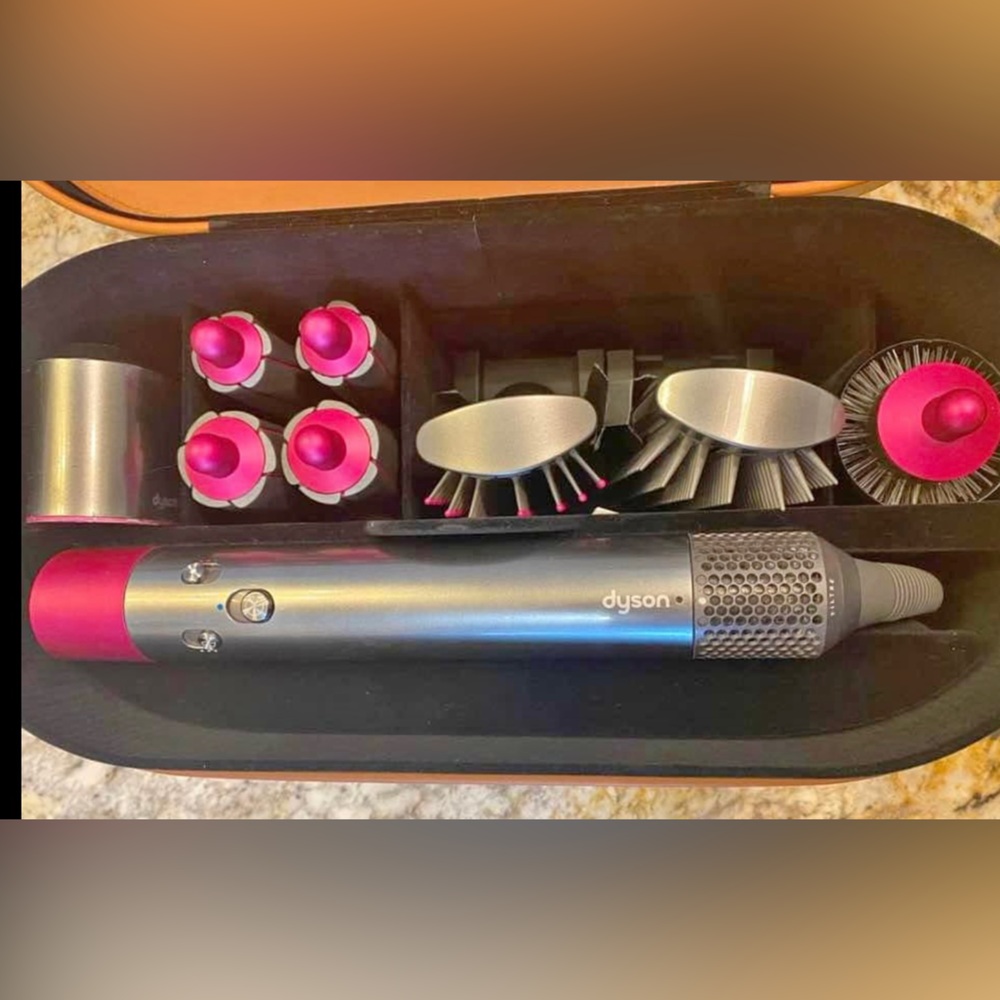 The Dyson Airwrap complete set. Find all your hair tools in one box.